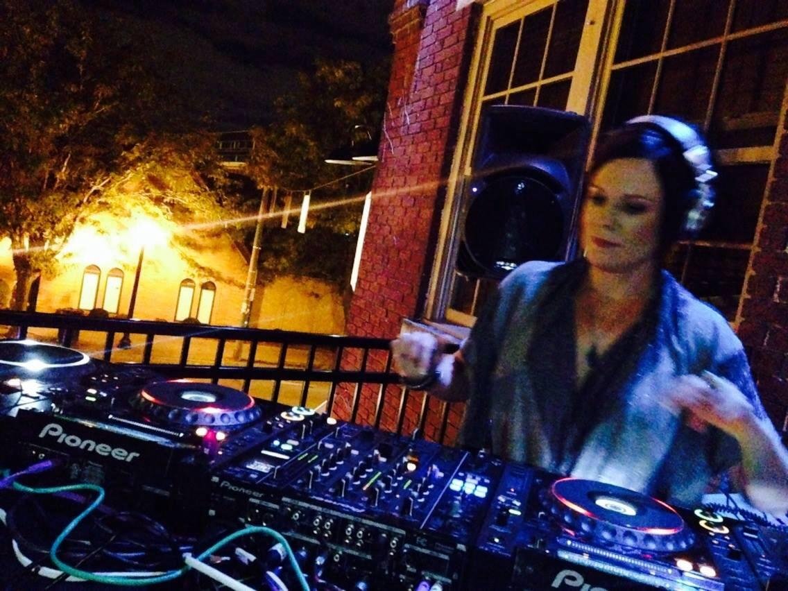 Shell Robinson DJing live behind Pioneer CDJs